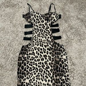 Symphony leopard print dress with cutout sides in size small.